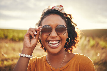 Happy, freedom and black woman with smile on a safari during a holiday in Africa. Face portrait of...
