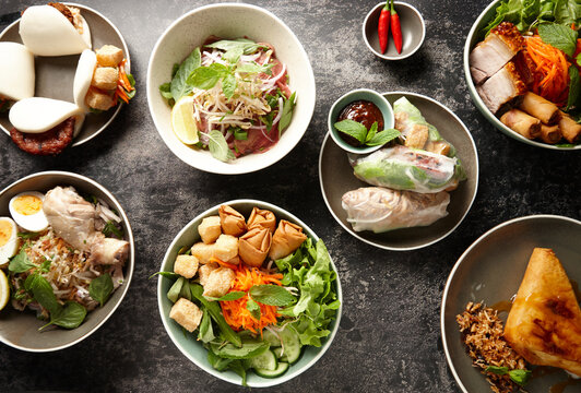 Top down of various Asian dishes on table