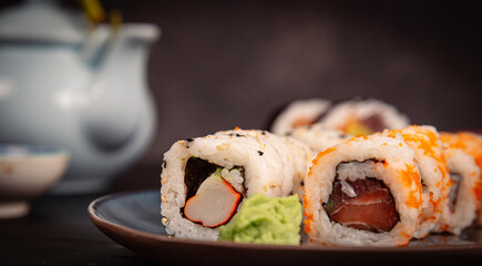 Sushi Set sashimi and sushi rolls on the restaurant table