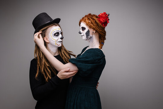 Couple costume for husband and wife mexican day of the dead. Scary skull makeup for halloween. Bride and groom dead zombie masquerade. All Saints' Day is a holiday. Scary faces. Idea for a carnival