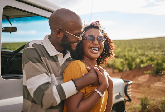 Travel, love and black couple on a road trip in nature on a happy summer holiday or vacation outdoors. Smile, happiness and fun woman hugging, bonding and relaxing with partner on a romantic journey