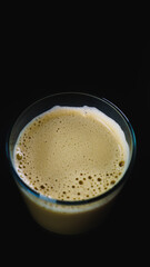 crystal coffee with milk glass with black background