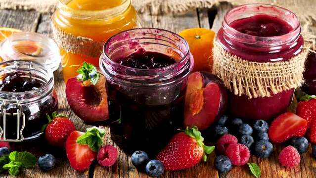 set of homemade jam and fresh fruit