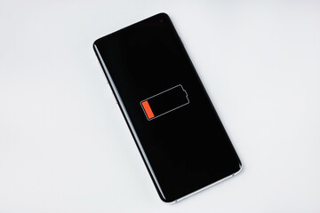 Smartphone lies with low battery display showing