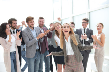 creative business team applaud the young businesswoman