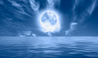 Naklejka na ściany i meble Full moon over the sea at sunset 