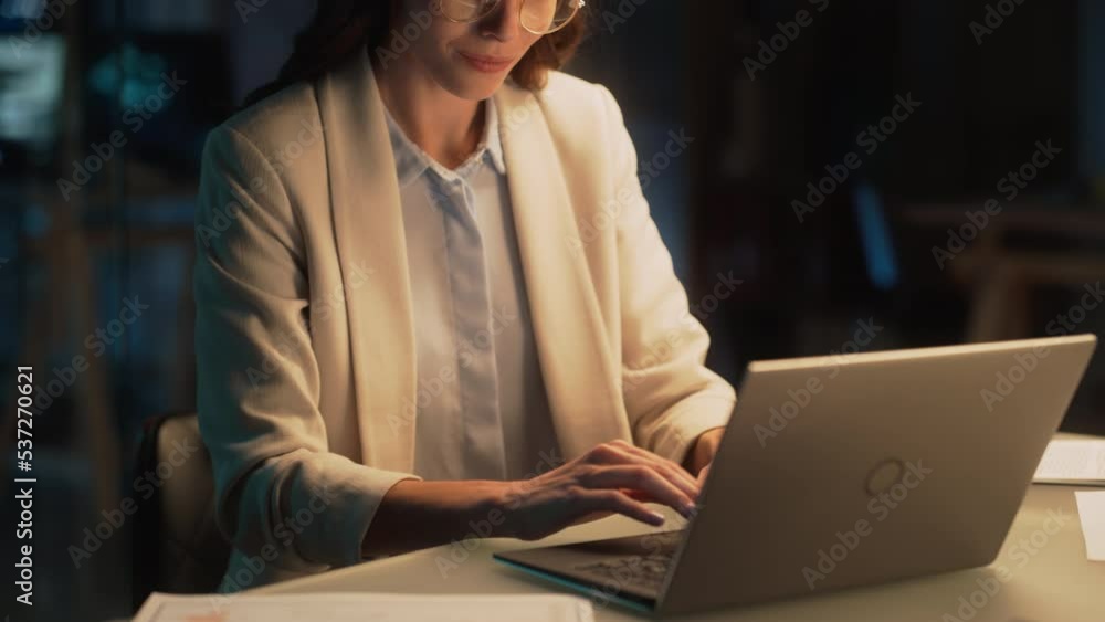 Poster close up portrait of a young accountant working in the office late in the evening. positive female u