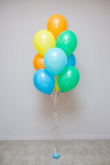 set of bright balloons for birthday, holiday decor with helium balloons