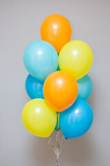 Fototapeta na wymiar set of bright balloons for birthday, holiday decor with helium balloons