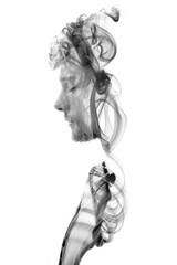 Double exposure portrait combined with swirls of smoke