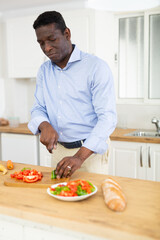 Fototapeta na wymiar Man preparing food at home