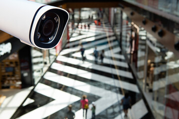 CCTV security camera on blur people in food center or shopping mall.