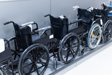 Fototapeta na wymiar A row of wheelchairs in the hospital, wheelchairs waiting for patient service