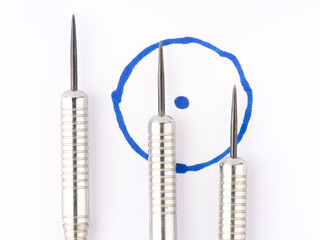 The concept of the goal and its achievement. Darts and a target. Closeup