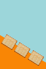 Pattern of cookies. Cookies on multi-colored background. Festive, children's background. Flat lay. Sweet cookies flat lay pattern on light pink background. Top view.