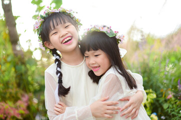 Two Asian sister in garden