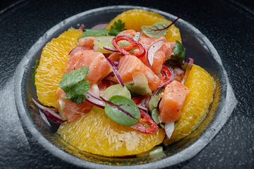 Ceviche with salmon, oranges, onions and herbs