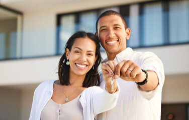 Happy couple, portrait and holding keys to house with smile for relationship goals and marriage together. Excited man and woman homeowners smiling with key moving in for real estate and new home