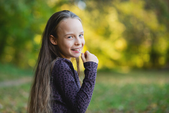 Cute girl sucking on a lollipop candy - Powered by Adobe