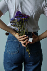 gel polish.girl holding gel polish.gel polish close up. white bottle close-up.nail polish and flowers on a white background.nail polish.female manicure.