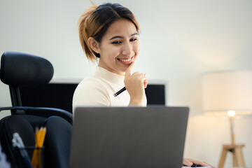 Asian women working in the office, young Asian business women as business executives, founding and running start-up executives, young female business leaders. Startup business concept.