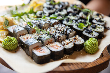 sushi roll with wasabi  on the plate. delicious food, close-up