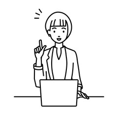 デスクで座ってPCを開いて何かひらめいたジャケットの女性