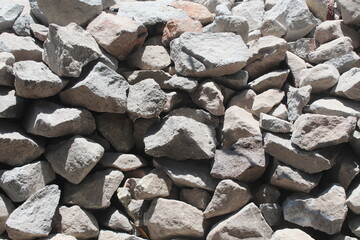 lots of white to gray stones to build a house