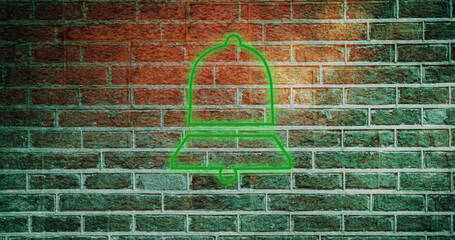 Composite of illuminated green digital notification bell icon against brick wall, copy space