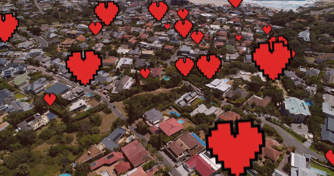 Image of digital hearts over cityscape