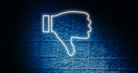 Composite of glowing dislike button icon against blue wall, copy space