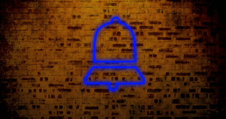 Composite of illuminated digital notification bell icon against abandoned brick wall, copy space