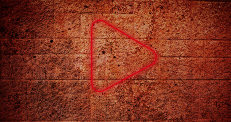 Composite of red play button icon against abandoned old wall, copy space