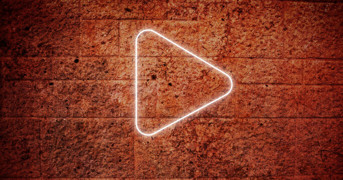 Composite of illuminated white play button icon against grunge wall, copy space - Powered by Adobe