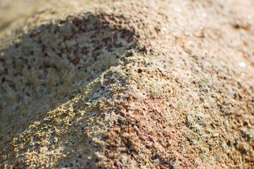 Beige stone surface close up.