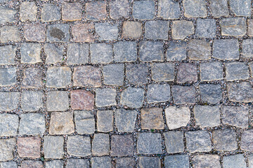 Brown square cobblestone sidewalk. Mock up or vintage grunge texture.