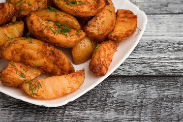 Potatoes, homemade stewed potatoes on a wooden white background