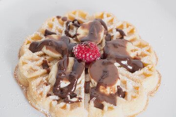Chocolate-covered banana and raspberry waffles, dessert	