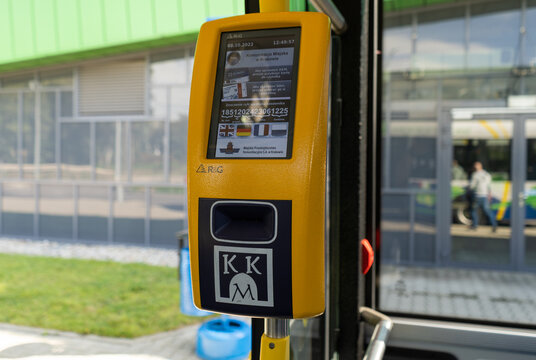 MPK Krak&oacute;w validation machine, with KKM Krakowska Karta Miejska (Cracow City Card) logo sign. Electronic validator for public transport bus or tram tickets on October 8, 2022 in Krakow, Poland.