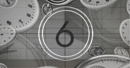 Image of number six in vintage black and white film projector countdown with clocks and watches