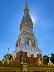 Naklejka premium Nakhon Phanom Province in THAILAND. Wat Phra That Phanom. Location Along the Mekong River. Peaceful and Believe in Buddhism. Blue Sky Colorful.