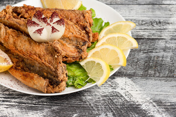 Fish, deep-fried fish on a wooden white background