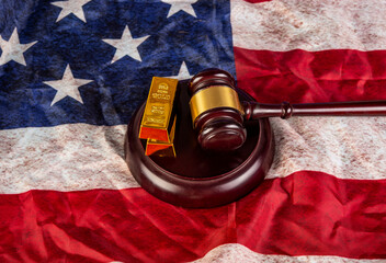 Gold bars with gavel on USA flag background