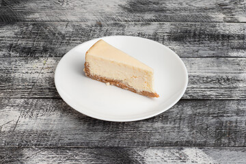 Cheesecake, classic cheesecake on a wooden white background