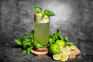still life of a mint and lime cocktail