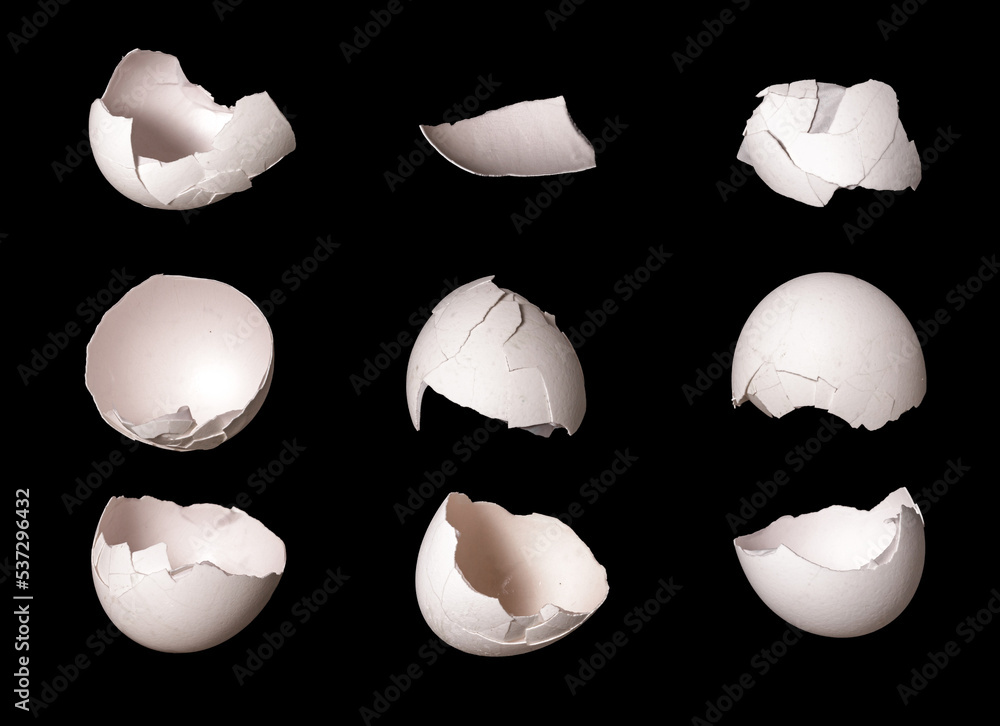 Poster white eggs. shell with cracks isolated on black background