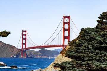 Famous Golden Gate bridge in San Francisco with a clear blue sky and wavy sea