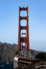 Famous Golden Gate bridge in San Francisco with a clear blue sky and wavy sea