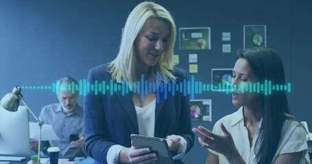 Animation of music equalizer over diverse female colleagues discussing over digital tablet at office - Powered by Adobe