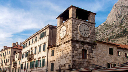 Fototapeta na wymiar The Old Clock Tower. Street view of the old town of Kotor, Montenegro, Clock Tower, Kotor.